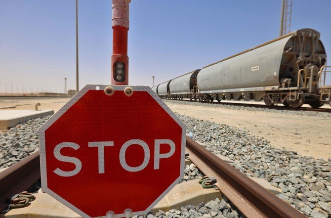 A stop sign near a train of the Etihad Rail network, in Al-Mirfa, in the United Arab Emirates. (AFP/Giuseppe Cacace)