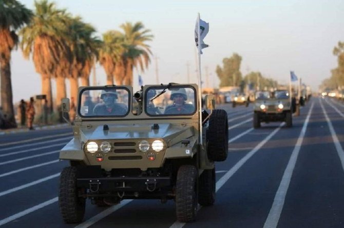 Members of Iraqi Popular Mobilization Forces take part in a military parade in Diyala province Iraq on June 26, 2021. (Media Office PMF via Reuters)
