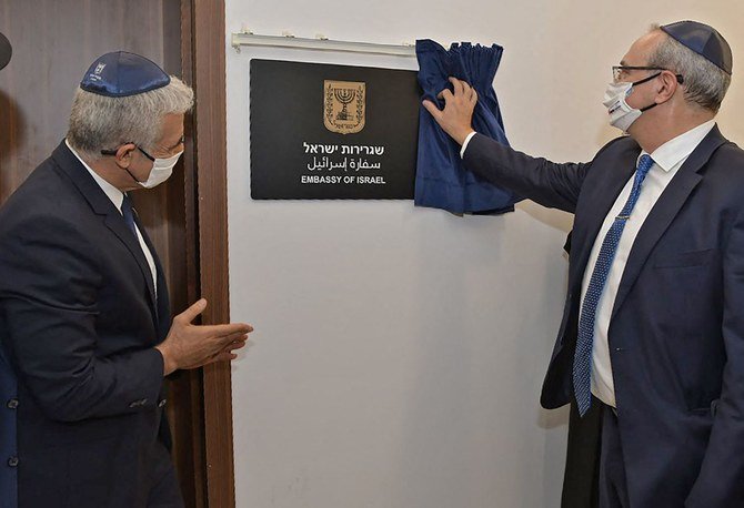 Israeli FM Yair Lapid (L) and Israeli Foreign Ministry's director general, Eitan Naa during the inauguration of the Israeli Embassy in Abu Dhabi. (AFP)