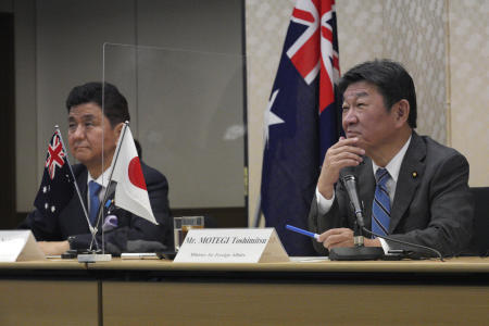 Japanese Foreign Minister Toshimitsu Motegi (right), and Defense Minister Nobuo Kishi attend a video conference with Australian Foreign Minister Marise Payne and Australian Defense Minister Peter Dutton at Foreign Ministry in Tokyo during their two-plus-two ministerial meeting Wednesday, June 9, 2021, in Tokyo. (AP)