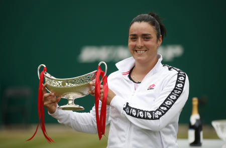 Tunisia's Ons Jabeur celebrates with the trophy after winning her final match against Russia's Daria Kasatkina. (Reuters)