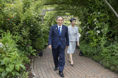 Japanese Prime Minister Yoshihide Suga and wife Mariko attend a reception for the G7 leaders at the Eden Project in Cornwall, England, during the G7 summit. (AP)