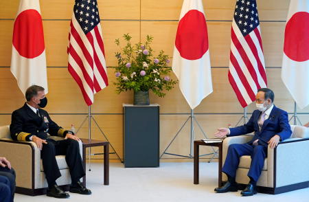 Admiral John C. Aquilino (left), Commander of the United States Indo-Pacific Command, and Japanese Prime Minister Yoshihide Suga meet at the prime minister's official residence in Tokyo, Japan, June 1, 2021. (Reuters)