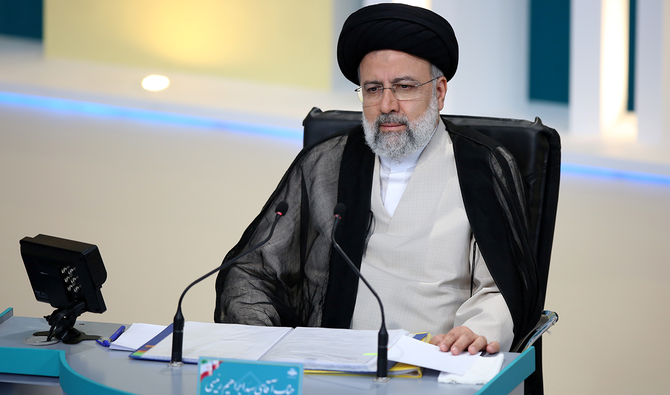 Presidential candidate Ebrahim Raisi attends an election debate at a television studio, in Tehran, Iran June 8, 2021. (Reuters)