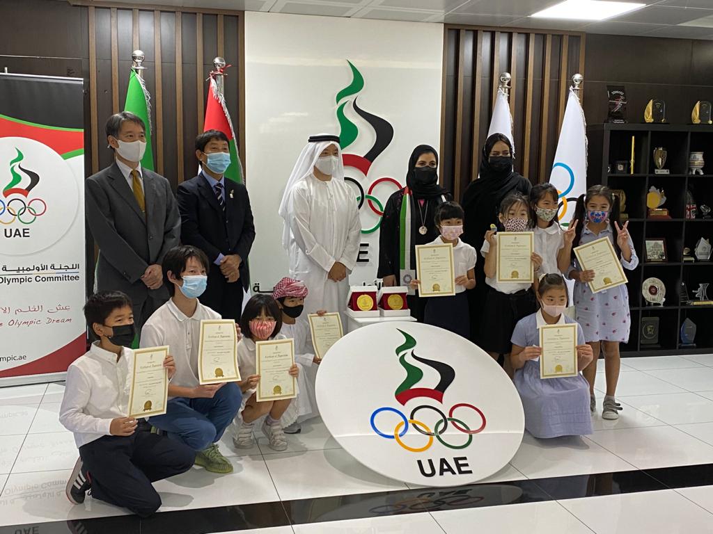 The silk scarf was then given to the UAE National Olympic Committee by one of the children.  After the official handover, the school children were then presented with certificates for their handwork. (ANJP)