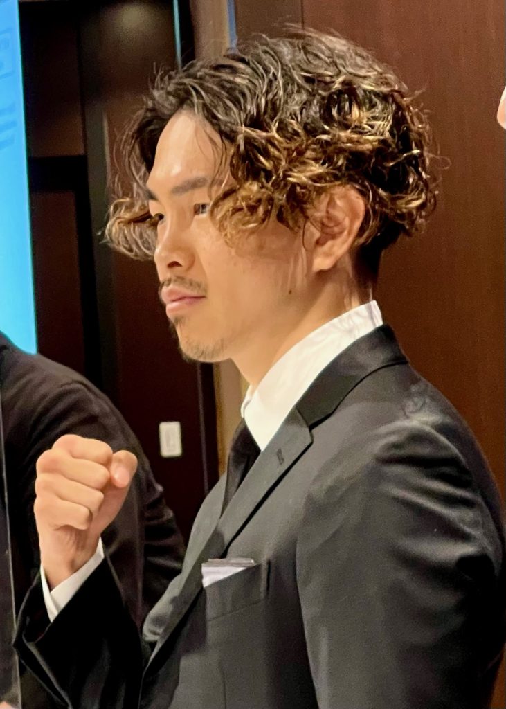 Japanese boxer Loki is seen posing to cameras before his press conference while his lawyer stands by his left side (ANJP photo)