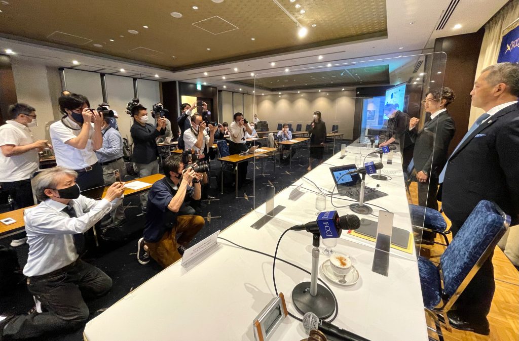 Japanese boxer Loki is seen posing to cameras before his press conference while his lawyer stands by his left side (ANJP photo)