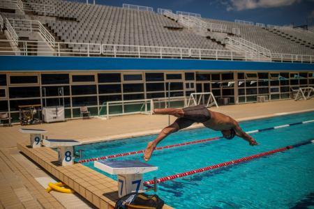 Syrian refugee Ibrahim al-Hussein takes part in a training session at the Olympic Aquatic Centre in Athens, on June 2, 2021. Ibrahim al-Hussein tries to become a part of a Refugee Paralympic Team for the Tokyo 2020 Paralympic Games. (AFP)