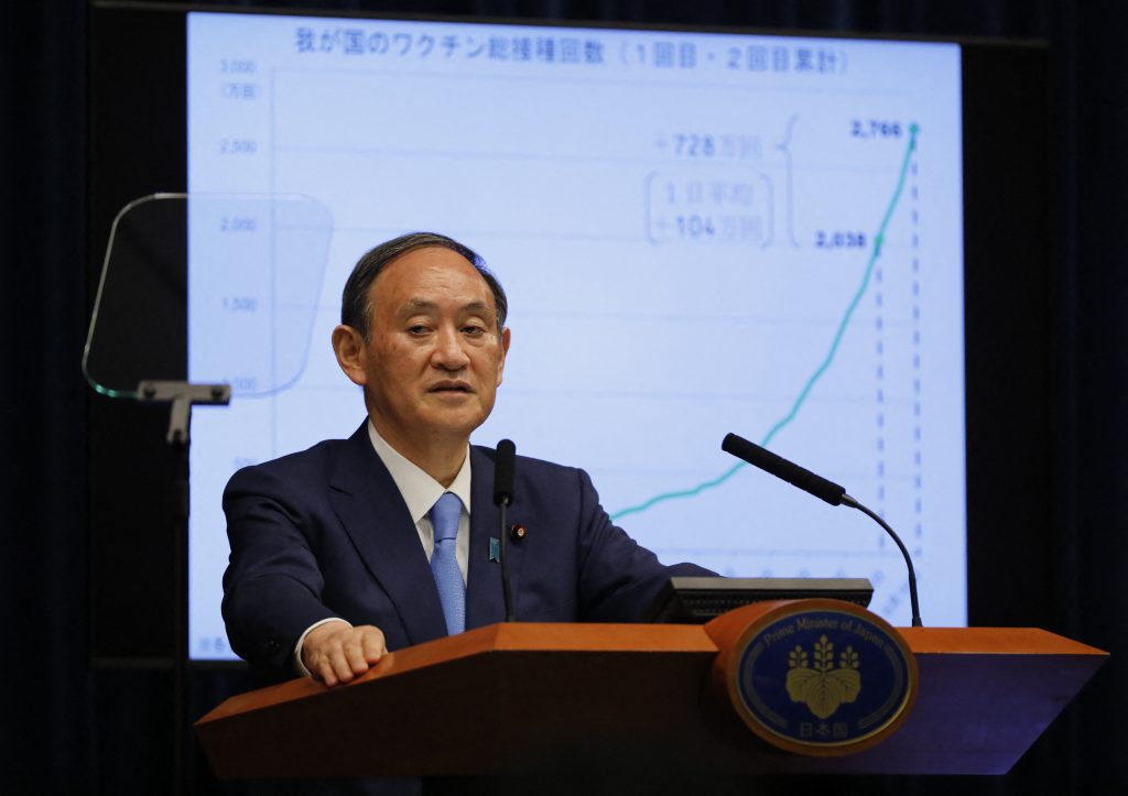 Yoshihide Suga repeated cautions that spectators could be locked out of competitions if the situation worsens. (AFP)