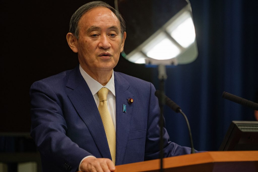 Japanese Prime Minister Yoshihide Suga told an APEC meeting on Friday he was determined to hold a safe and secure Olympics. (AFP)