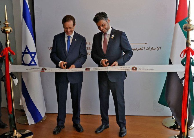 Israeli President Isaac Herzog and Emirati Ambassador to Israel Mohamed Al-Khaja cut the ribbon at the new UAE embassy in Tel Aviv. (AFP)