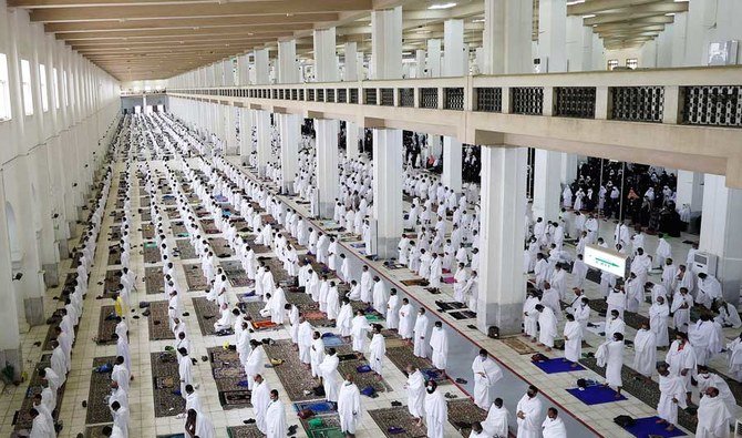 Muslim pilgrims pray at the Namira Mosque on Arafat Day, the climax of the Hajj pilgrimage, in Saudi Arabia's holy city of Mecca on July 19, 2021. (AFP)