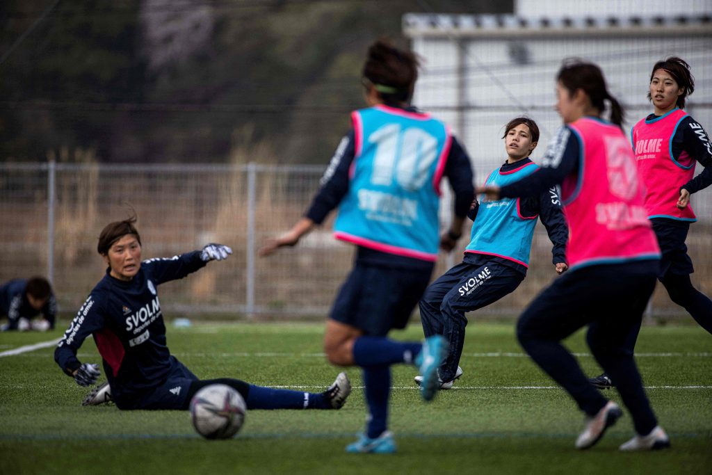 This photo taken on March 31, 2021 shows players from Japan's women football team Chifure AS Elfen Saitama playing during a training session in Hanno, Saitama prefecture. As global interest in women's football approaches fever pitch, former champions Japan are eyeing a return to glory with the country's first professional league for female players. (AFP)