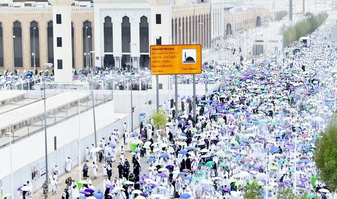 Muslim pilgrims pray at the Namira Mosque on Arafat Day, the climax of the Hajj pilgrimage, in Saudi Arabia's holy city of Mecca on July 19, 2021. (AFP)