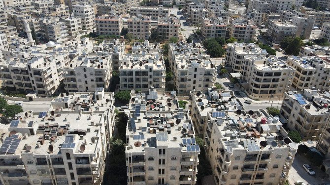 Solar panels are seen on the rooftops of buildings in the town of Dana, Idlib province, Syria, on June 10, 2021. (AFP / Aaref Watad)