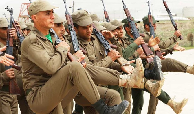 Syrian-Kurdish Peshmerga fighters and members of the Rojava Forces Defence Units take part in routine military exercises in the town of Faysh Khabur. (AFP file photo)