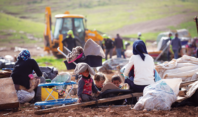 The army arrived without warning at 9 a.m., asked the residents to move, and when they refused, began flattening the makeshift homes. (AP)