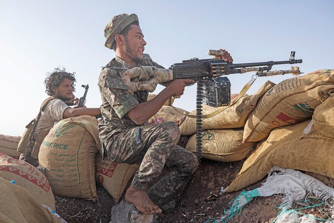 Yemeni fighters man a post on Al-Kasara front line, near Marib. (AP)
