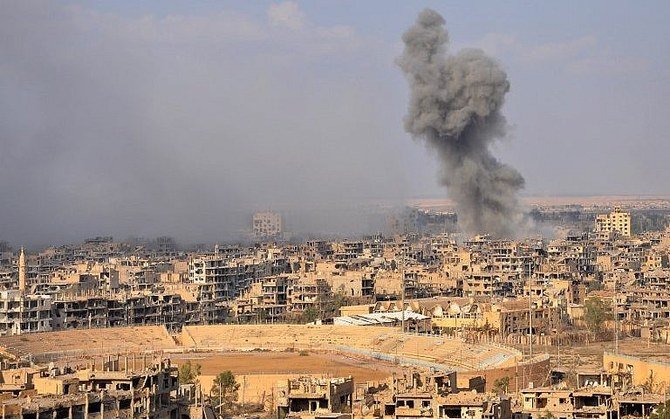 File photo shows smoke billowing from the eastern city of Deir Ezzor. (AFP)
