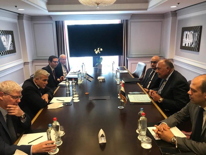 Egyptian Foreign Minister Sameh Shoukry meets his Israeli counterpart Yair Lapid in Brussels. (Twitter/@MfaEgypt)