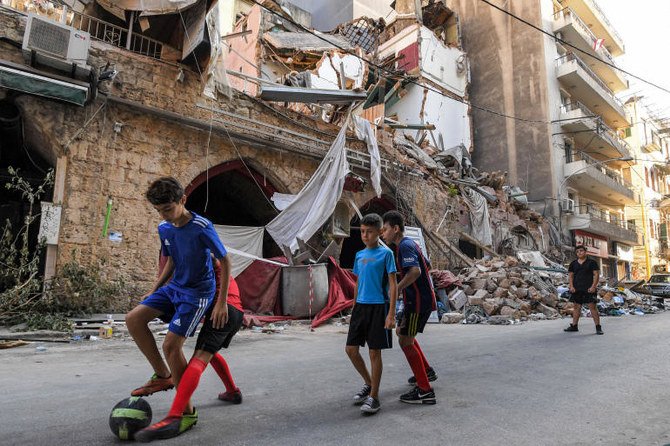 Children play on a street in the Gemmayzeh district of Lebanon’s capital Beirut after the monster blast at the nearby port that devastated the city, August 2020. (AFP)