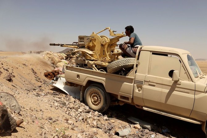 A fighter loyal to the Yemeni government fires a vehicle-mounted weapon at Houthi positions in Marib, Yemen, March 28, 2021. (Reuters)