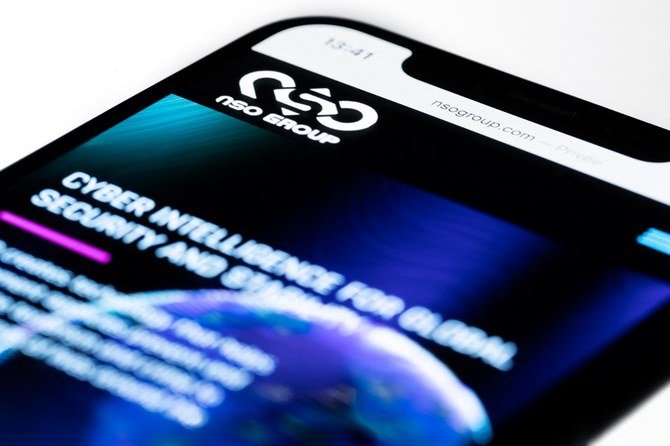 This studio photographic illustration shows a smartphone with the website of Israel's NSO Group which features 'Pegasus' spyware, on display in Paris on July 21, 2021. (File/AFP)