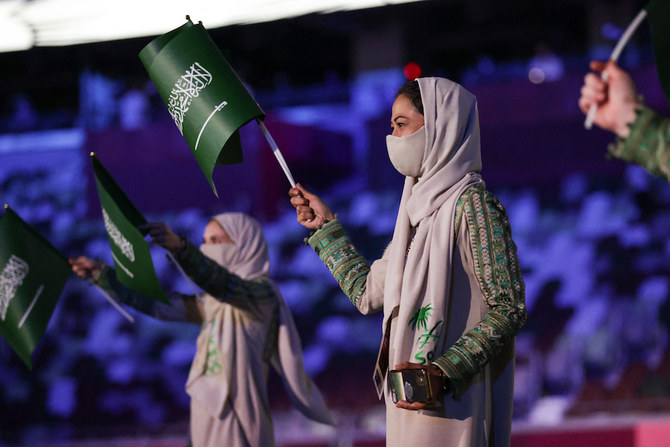 Saudi Arabia's delegation enters the Olympic Stadium during Tokyo 2020 Olympic Games opening ceremony's parade of athletes, in Tokyo on July 23, 2021. (AFP)