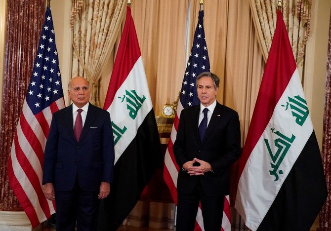 Iraq’s FM Fuad Hussein and US Secretary of State Antony Blinken face reporters as they meet at the State Department in the US on July 23, 2021. (Reuters)