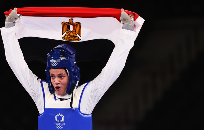Hedaya Malak Wahba of Egypt celebrates winning bronze with the Egyptian flag. (Reuters)