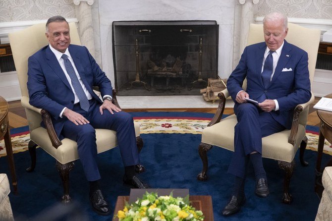 US President Joe Biden talks with Iraqi Prime Minister Mustafa Al-Kadhimi (L) in the Oval Office of the White House in Washington, DC, July 26, 2021. (AFP)