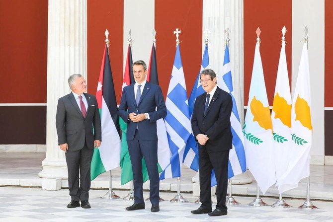 Greek Prime Minister Kyriakos Mitsotakis, Cyprus’ President Nicos Anastasiades and Jordan’s King Abdullah II pose during a Trilateral Meeting between Greece, Cyprus and Jordan, in Athens on Wednesday. (Reuters)