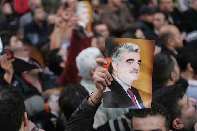 A picture of the late former Lebanese PM Rafic Hariri is shown during a rally by his supporters outside his house in Beirut. (AFP file)