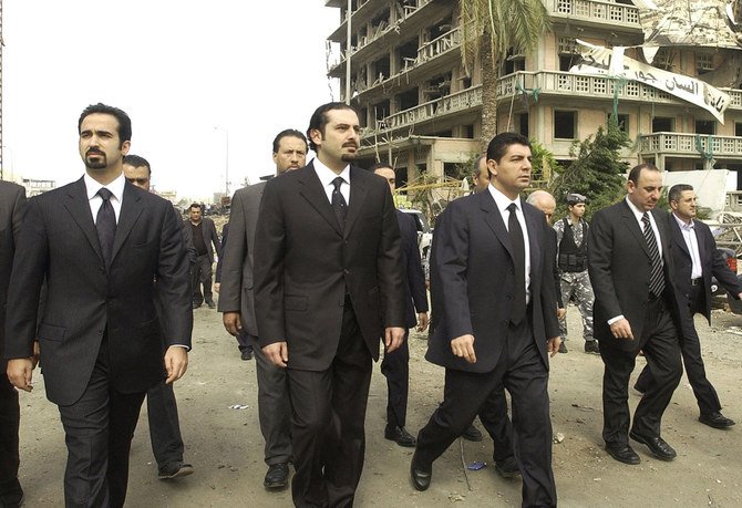 In this Feb. 19, 2005, photo, three of the sons of slain Lebanese former PM Rafiq Hariri, (from L to R) Ayman, Saadeddin and Bahaa visit the site of the massive explosion in which their father was killed on Feb. 14. (AFP file)
