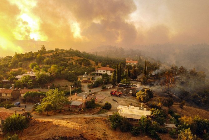 Wildfire engulfs a Mediterranean resort region on Turkey's southern coast near the town of Manavgat on July 30, 2021. (AFP)
