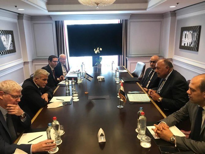 Egyptian Foreign Minister Sameh Shoukry meets his Israeli counterpart Yair Lapid in Brussels. (Twitter/@MfaEgypt)