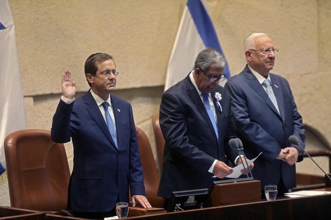 Isaac Herzog (left), a Labour Party veteran, is sworn in, before parliament, as Israel’s 11th president, replacing Reuvin Rivlin (right), at the Knesset, in Jerusalem, on July 7, 2021. (AFP)