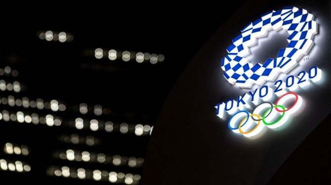 The Tokyo 2020 Olympic Games logo is pictured, 30 days before the opening ceremony, outside the Tokyo station in Tokyo on June 22, 2021. (AFP)