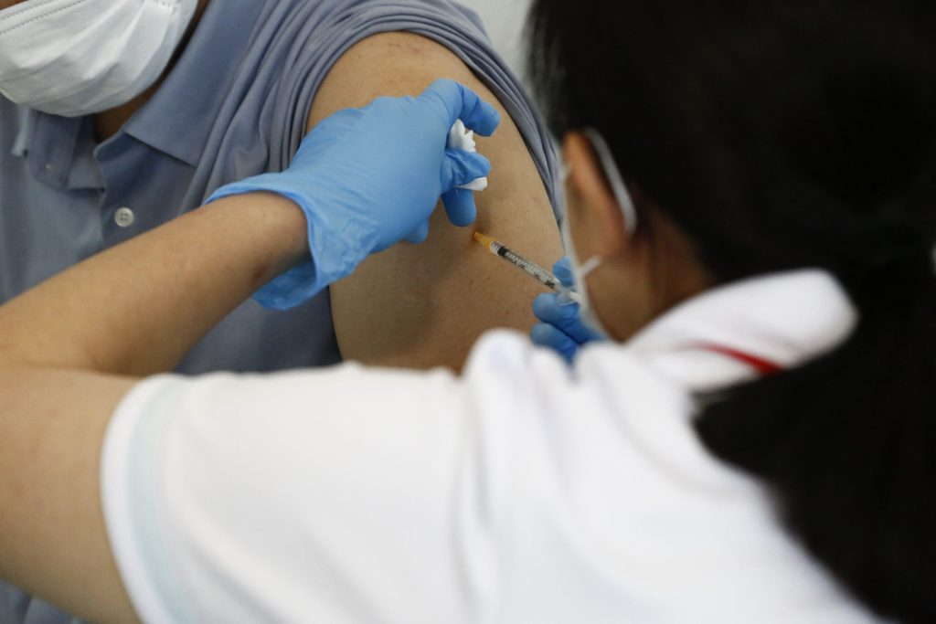 The COVID-19 vaccinations for such people are being carried out at Tokyo International Airport at Haneda and Narita International Airport in Chiba Prefecture. (AFP)