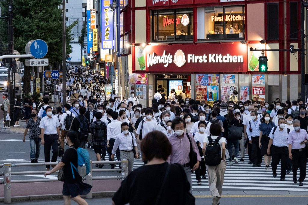 People walk towards Shinjuku Station, Aug. 5, 2021. (AFP)