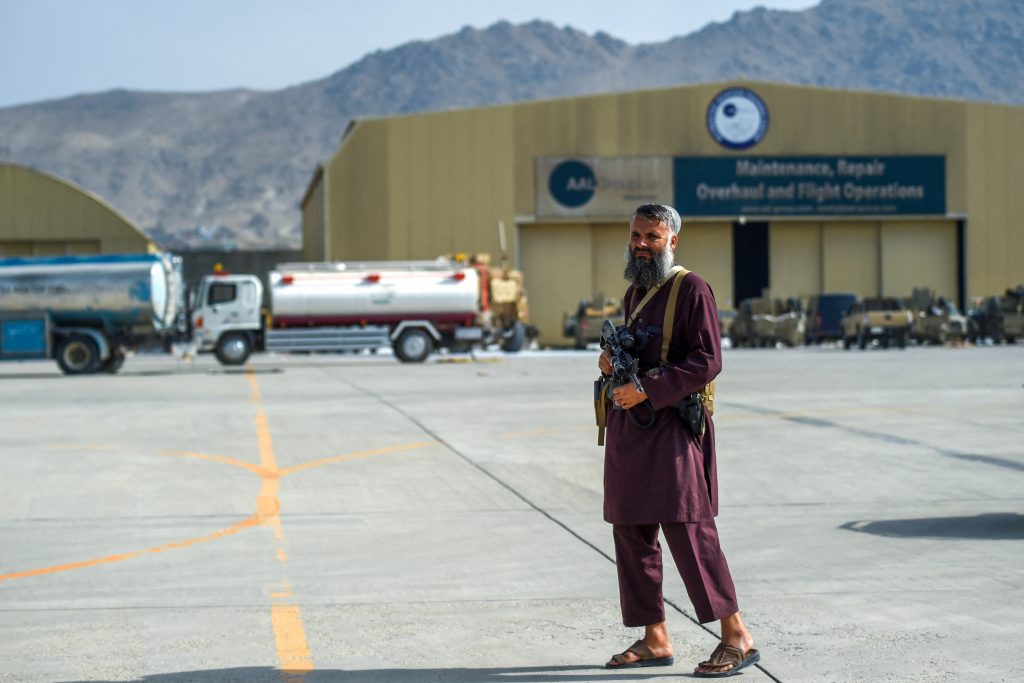 A Taliban fighter stands guard at the airport in Kabul after the US has pulled all its troops out of the country, Aug. 31, 2021. (AFP)
