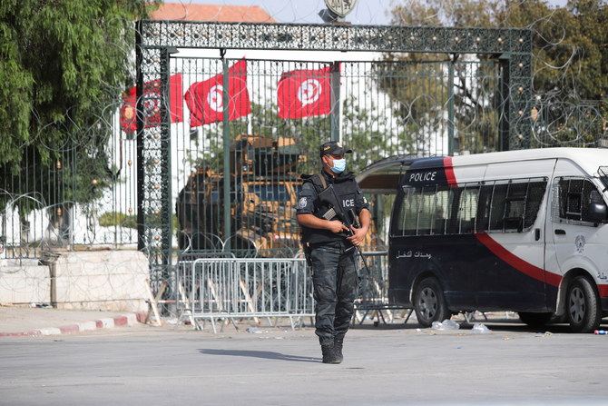 A police officer stands guard outside the parliament building in Tunis,Tunisia on July 29, 2021. (Reuters)