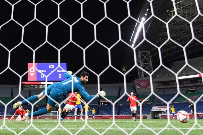 Egypt’s goalkeeper Mohamed El-Shenawy concedes a goal during the Tokyo 2020 Olympic Games men’s quarter-final football match between Brazil and Egypt at Saitama Stadium in Saitama on July 31, 2021. (AFP)
