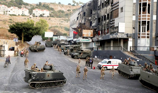Lebanese army is deployed after clashes erupted in Khalde, Lebanon, on Sunday. The clashes broke between two groups during the funeral of a Hezbollah supporter killed a day earlier. (Reuters)