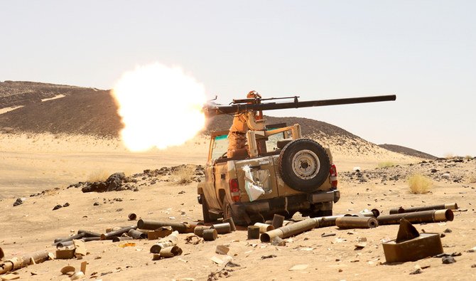 A Yemeni government fighter fires a vehicle-mounted weapon at a frontline position during fighting against Houthi fighters in Marib, Yemen March 9, 2021. (Reuters)a