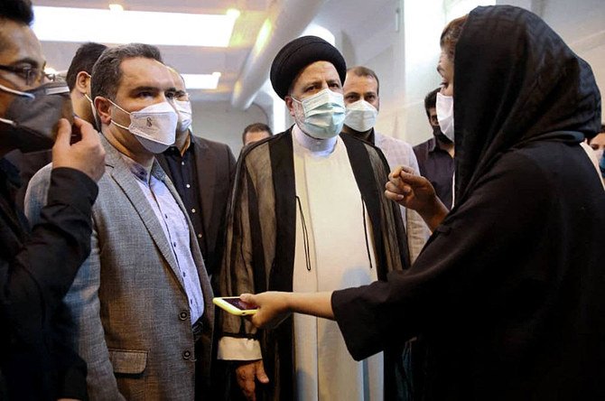 Iran's President Ebrahim Raisi visits Imam Khomeini Hospital and Corona Vaccination Center in the capital Tehran. Iran reported over 500 daily COVID-19 deaths for the first time, its health ministry announced. (AFP)