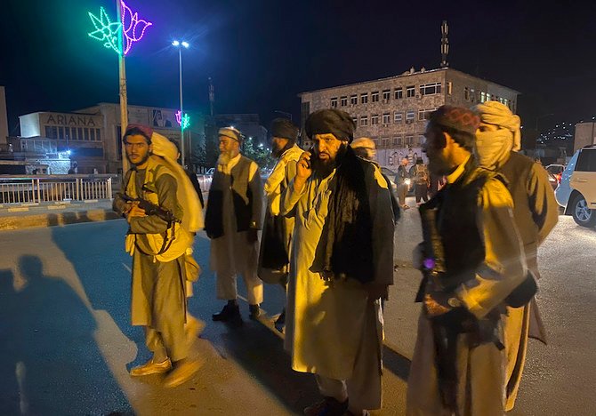 Taliban fighters take control of Afghan presidential palace after the Afghan President Ashraf Ghani fled the country, in Kabul, Afghanistan, Sunday, Aug. 15, 2021. (AP)