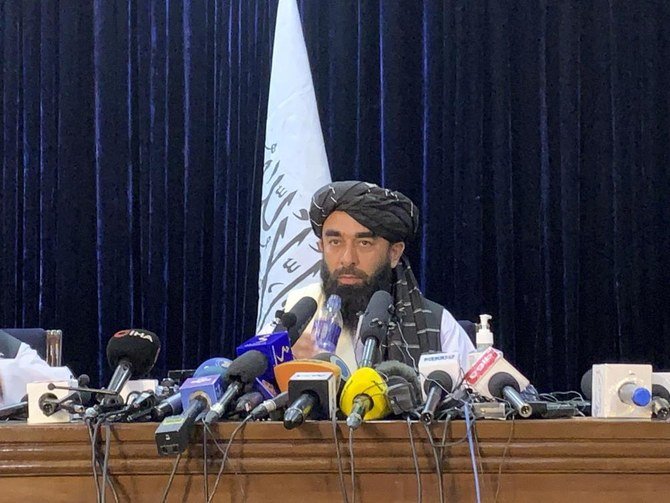 Taliban spokesman Zabihullah Mujahid addresses his first news conference in Kabul on Tuesday when he said the insurgents sought no revenge and that everyone is forgiven (AP)