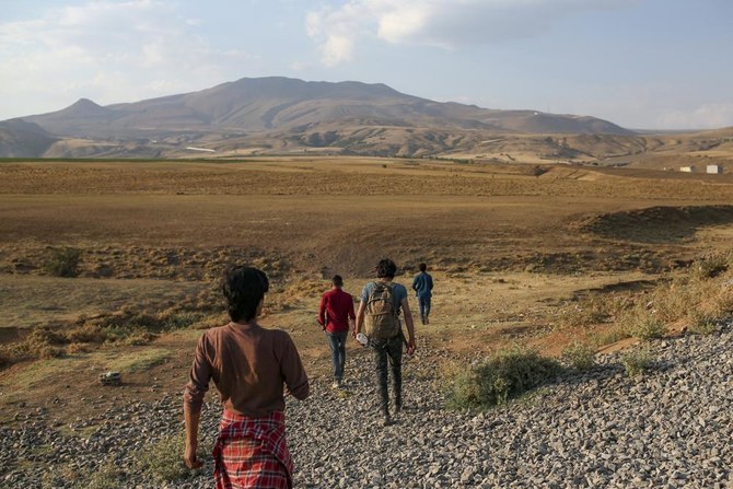 Young men who say they deserted the Afghan military and fled to Turkey through Iran stand in the countryside in Tatvan, in Bitlis Province in eastern Turkey, Aug. 17, 2021. (File/AP)