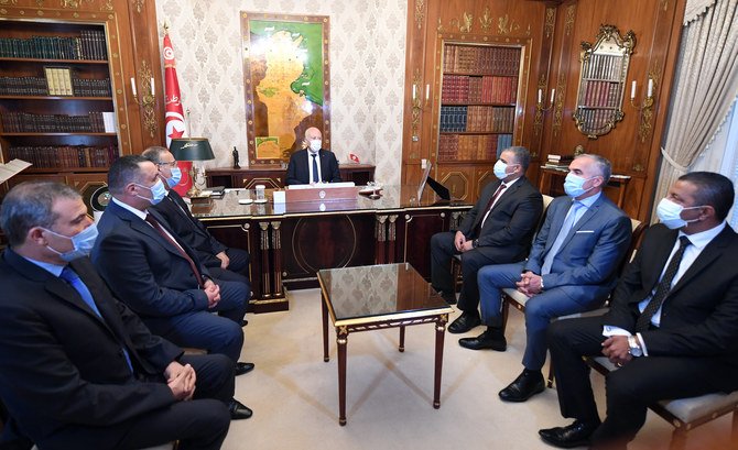 Tunisian President Kais Saied attends a meeting acting Interior Minister Ridha Gharsallaoui in the capital, Tunis, on Wednesday, Aug. 18, 2021. (TAP News Agency)
